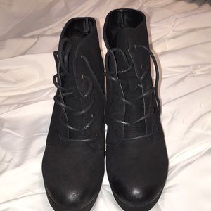 Black heeled tie up boots